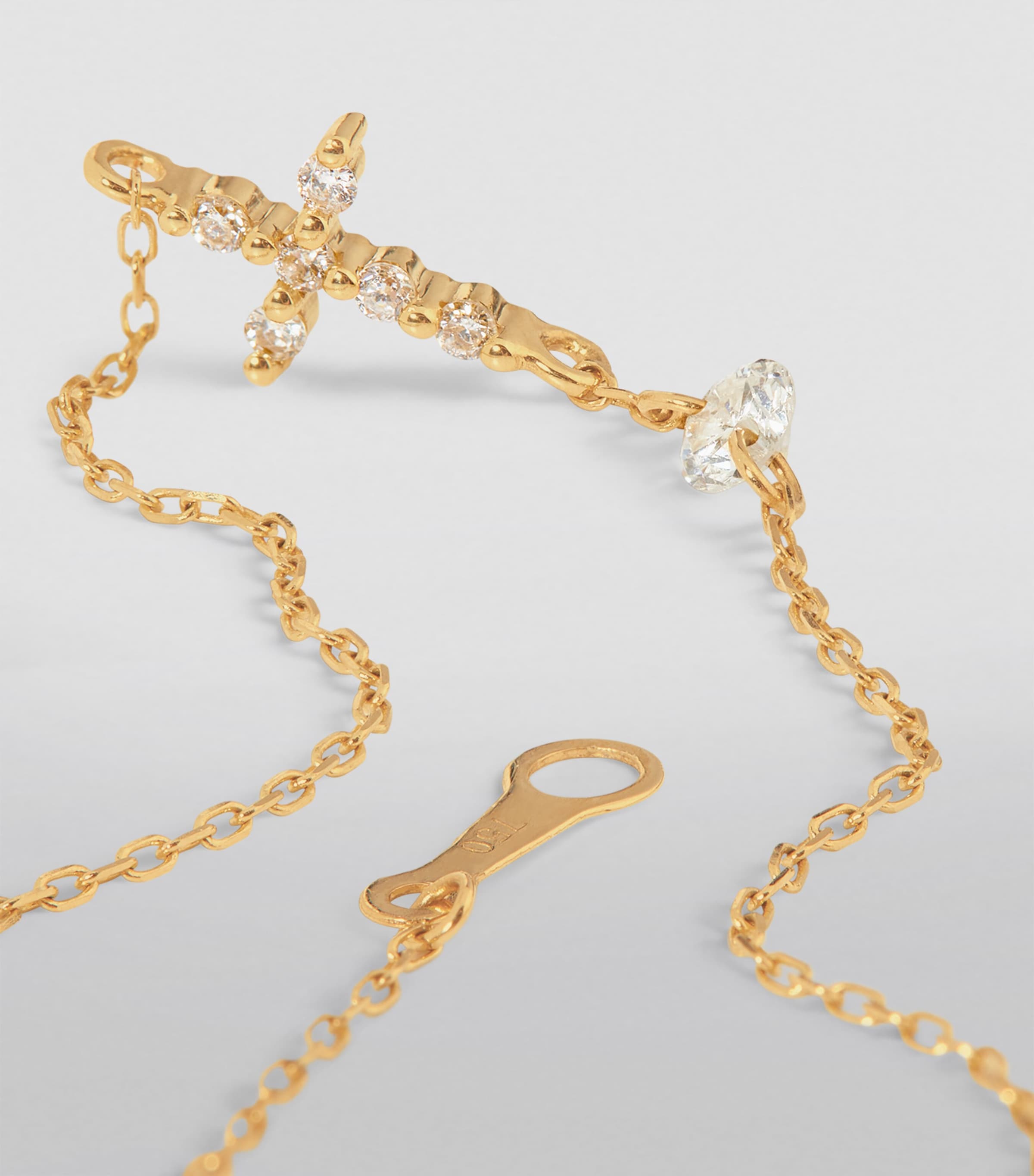 Persée gold cross bracelet with diamonds (British brand)