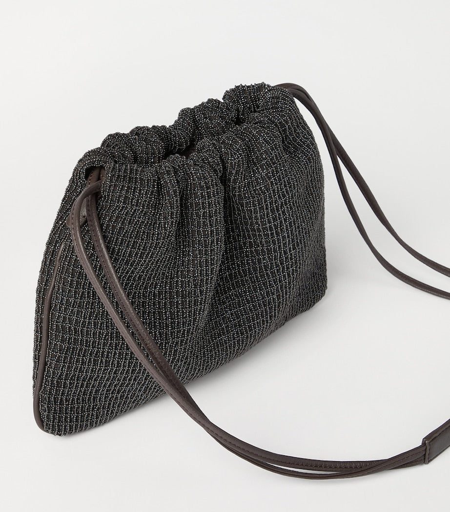 Brunello Cucinelli embellished drawstring cross-body bag, imported from the UK