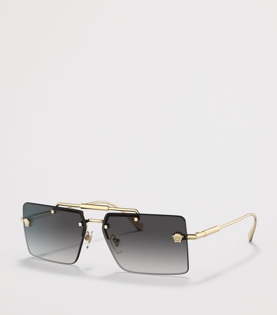 Lunettes de soleil rectangulaires sans monture Versace en métal doré - Produit britannique