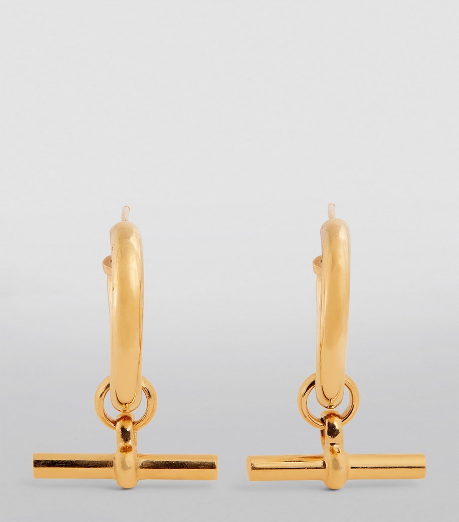 Tilly Sveaas large gold-plated T-bar hoop earrings, UK version