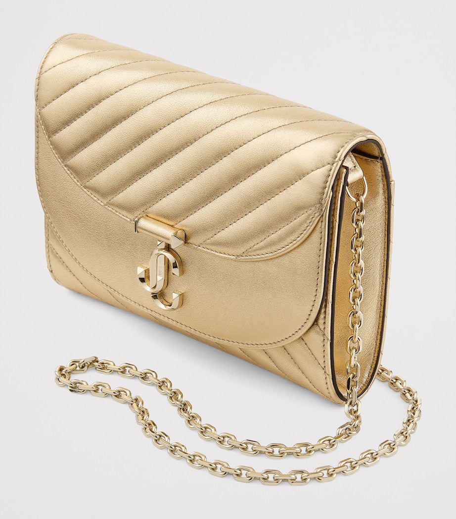 Jimmy Choo Curve clutch bag in metallic leather, imported from the UK