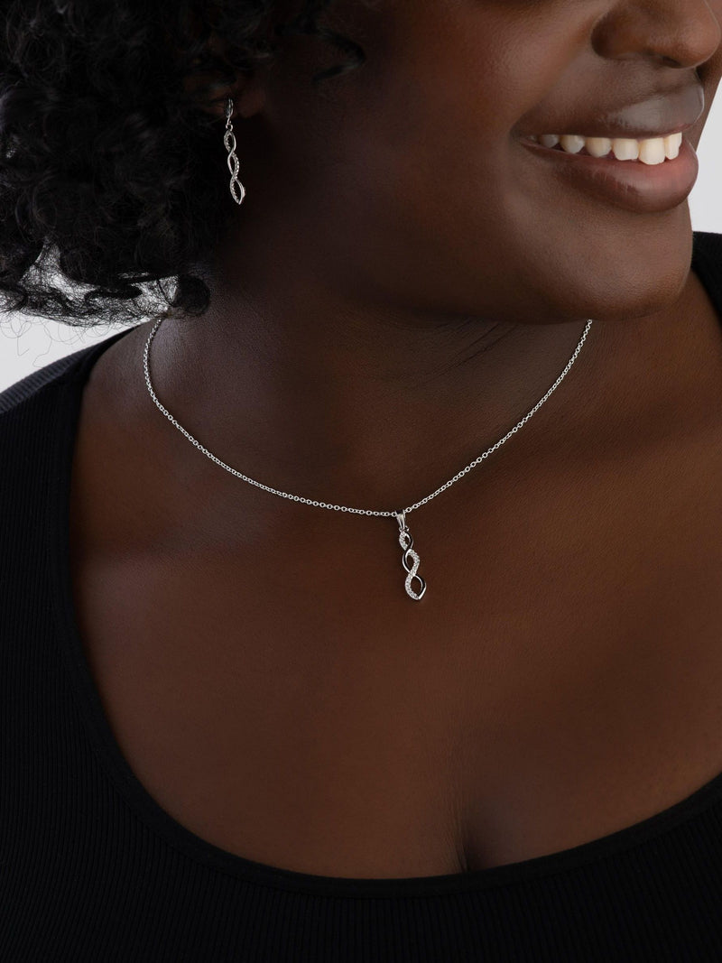 Infinity cubic zirconia pendant and earrings set in sterling silver (British brand)