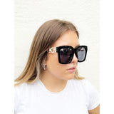SVNX oversized sunglasses with gold chain detail, imported from the UK