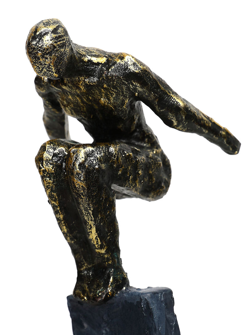 Libra Interiors antique gold bronze balancing act figures sculpture (British brand)