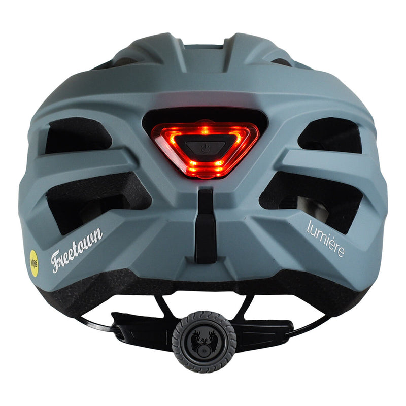 Freetown bike helmet in blue, white, and grey, imported from the UK