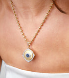 Annoushka gold evil eye charm pendant with diamonds and sapphire, UK version