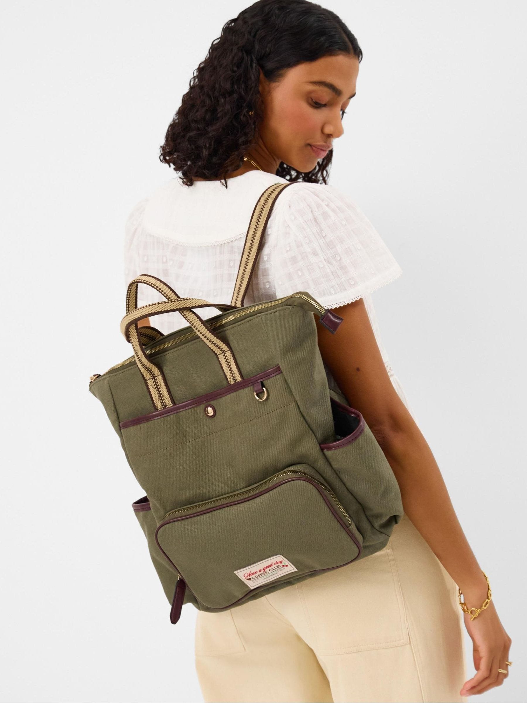 Accessorize green canvas multi-pocket backpack, imported from the UK