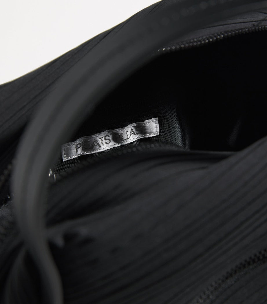 Pleats Please Issey Miyake mini bias pleats duffle bag, imported from the UK