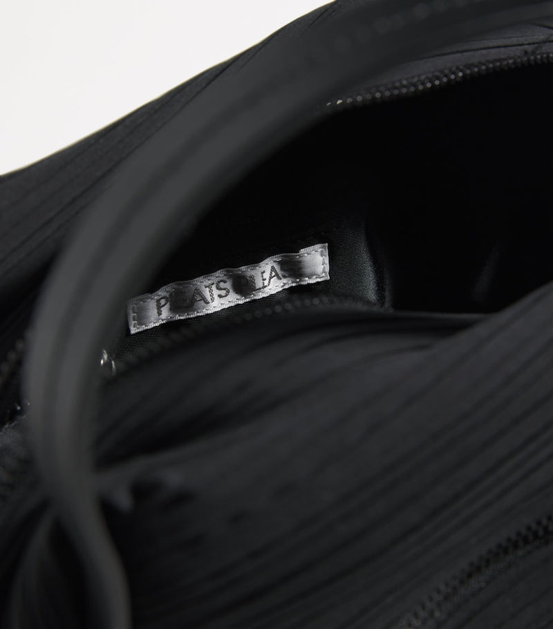 Pleats Please Issey Miyake mini bias pleats duffle bag, imported from the UK