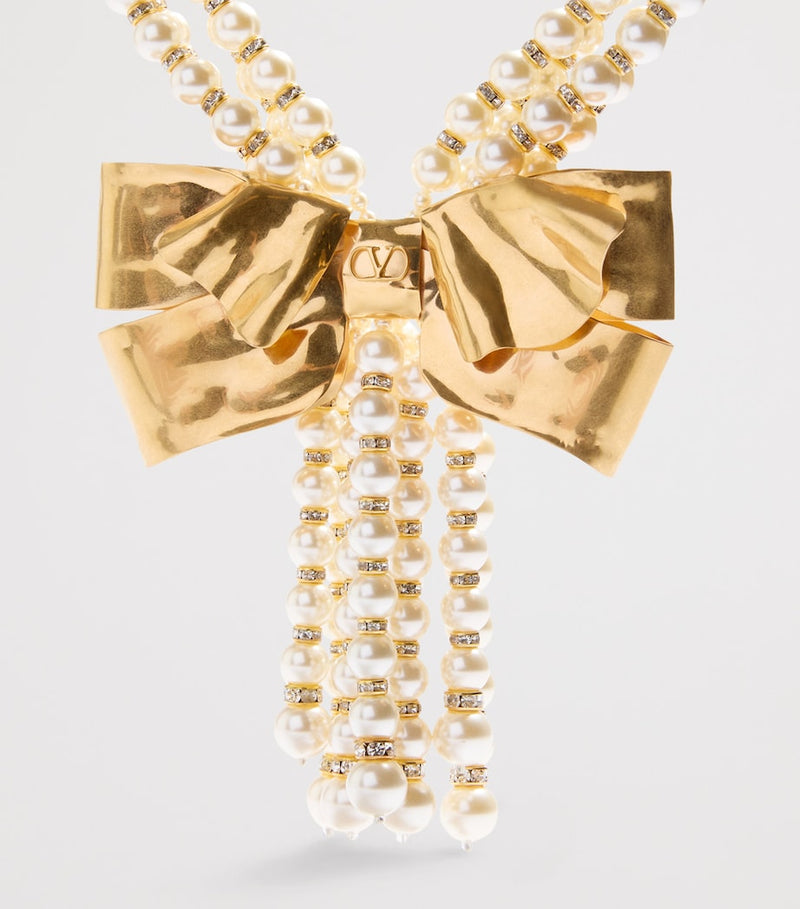 Valentino Garavani faux pearl layered necklace with brass bows, UK version