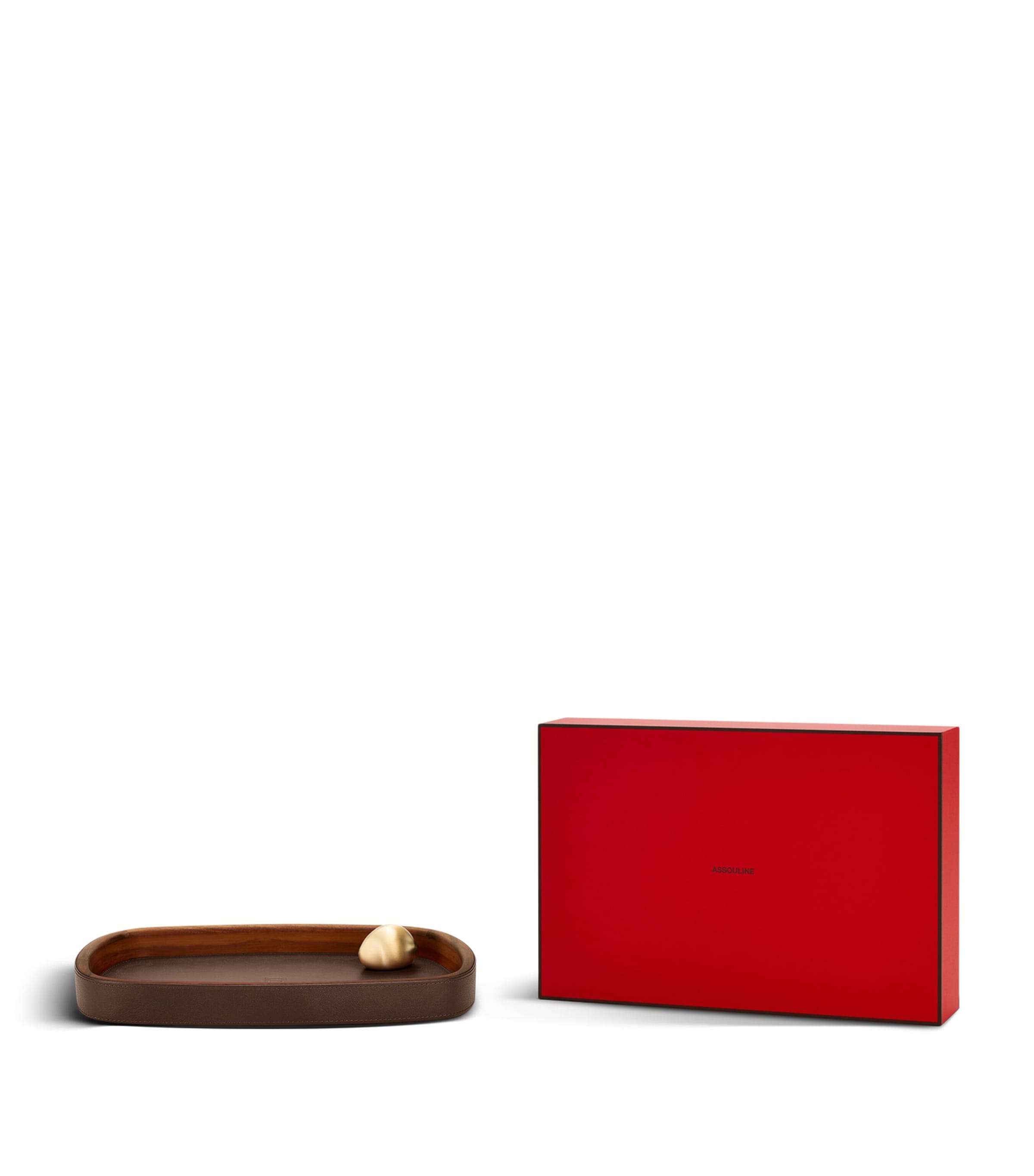 Assouline leather pebble trinket tray with movable brass pebble - British product