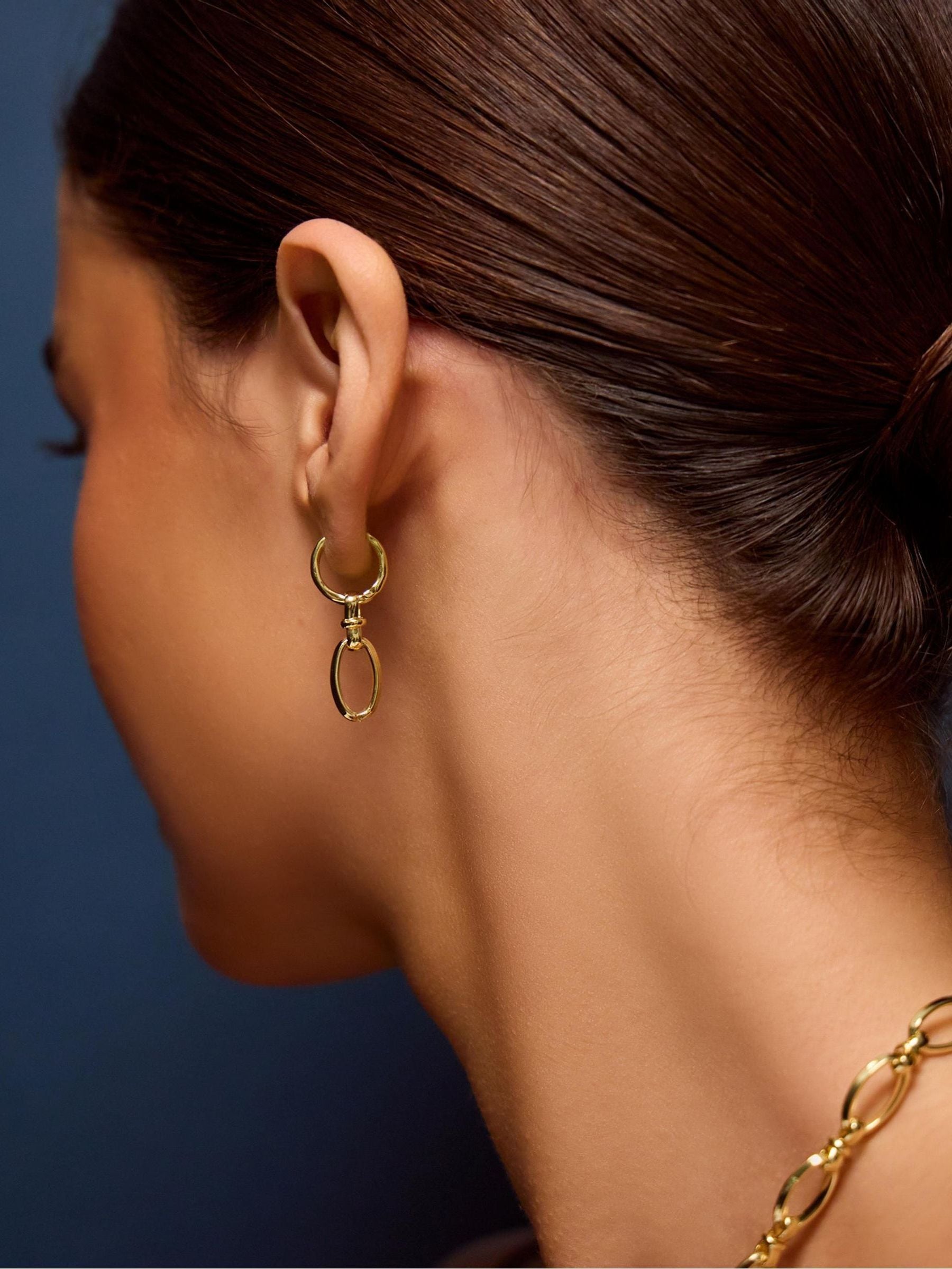 Accessorize gold tone knot drop hoop earrings, imported from the UK