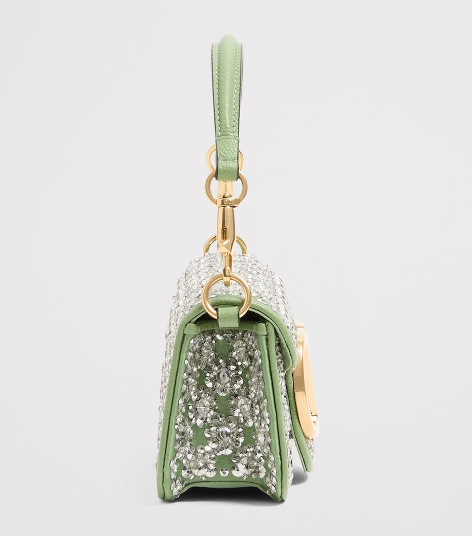 Valentino Garavani small Locò embellished shoulder bag, imported from the UK