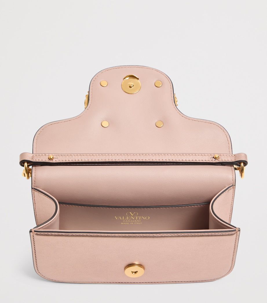 Valentino Garavani Small Leather Locò shoulder bag, imported from the UK