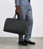 Harrods leather holdall with gunmetal hardware, imported from the UK
