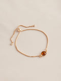 Gold tone birthstone pully bracelet, UK version