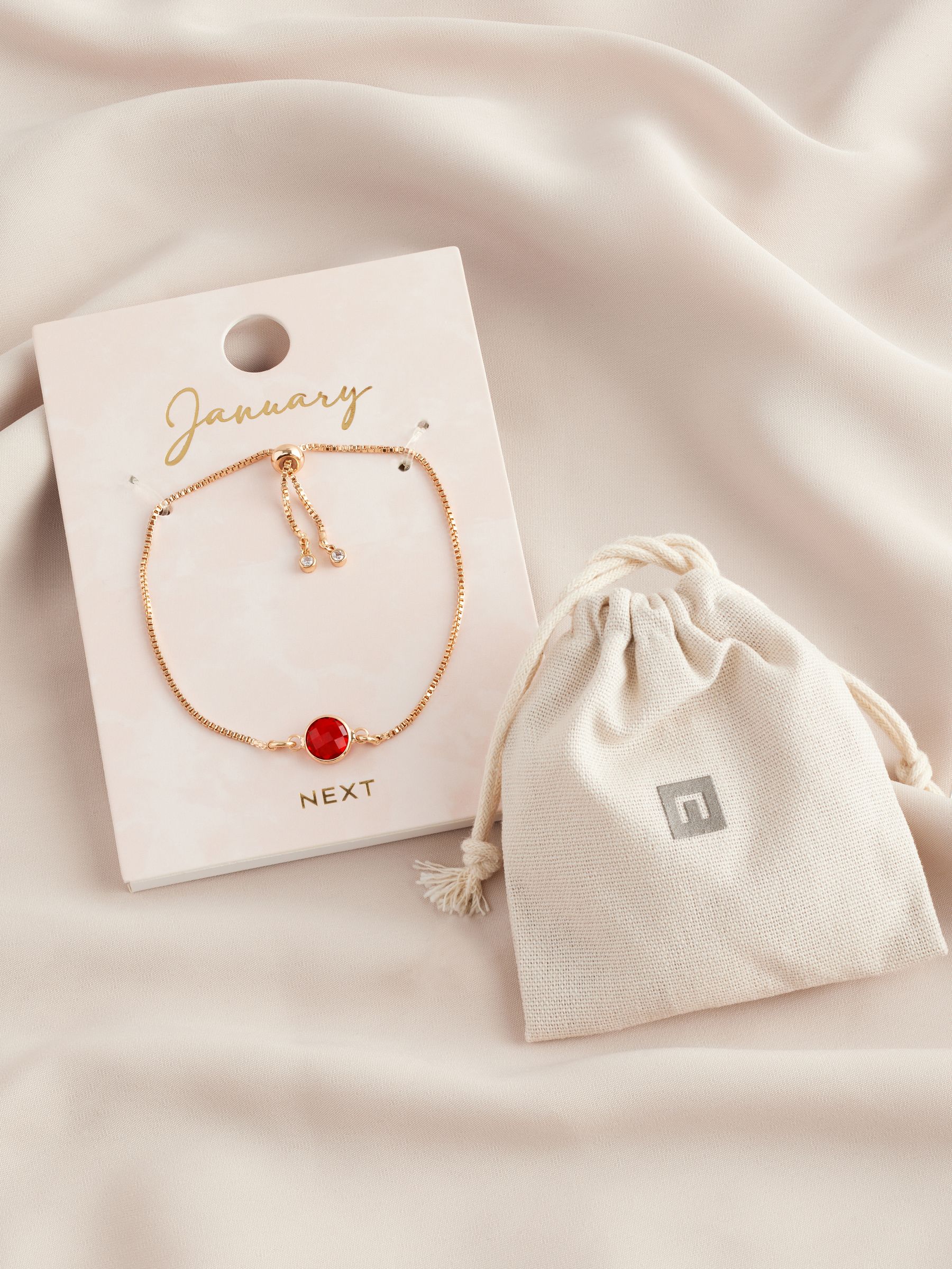 Gold tone birthstone pully bracelet, UK version
