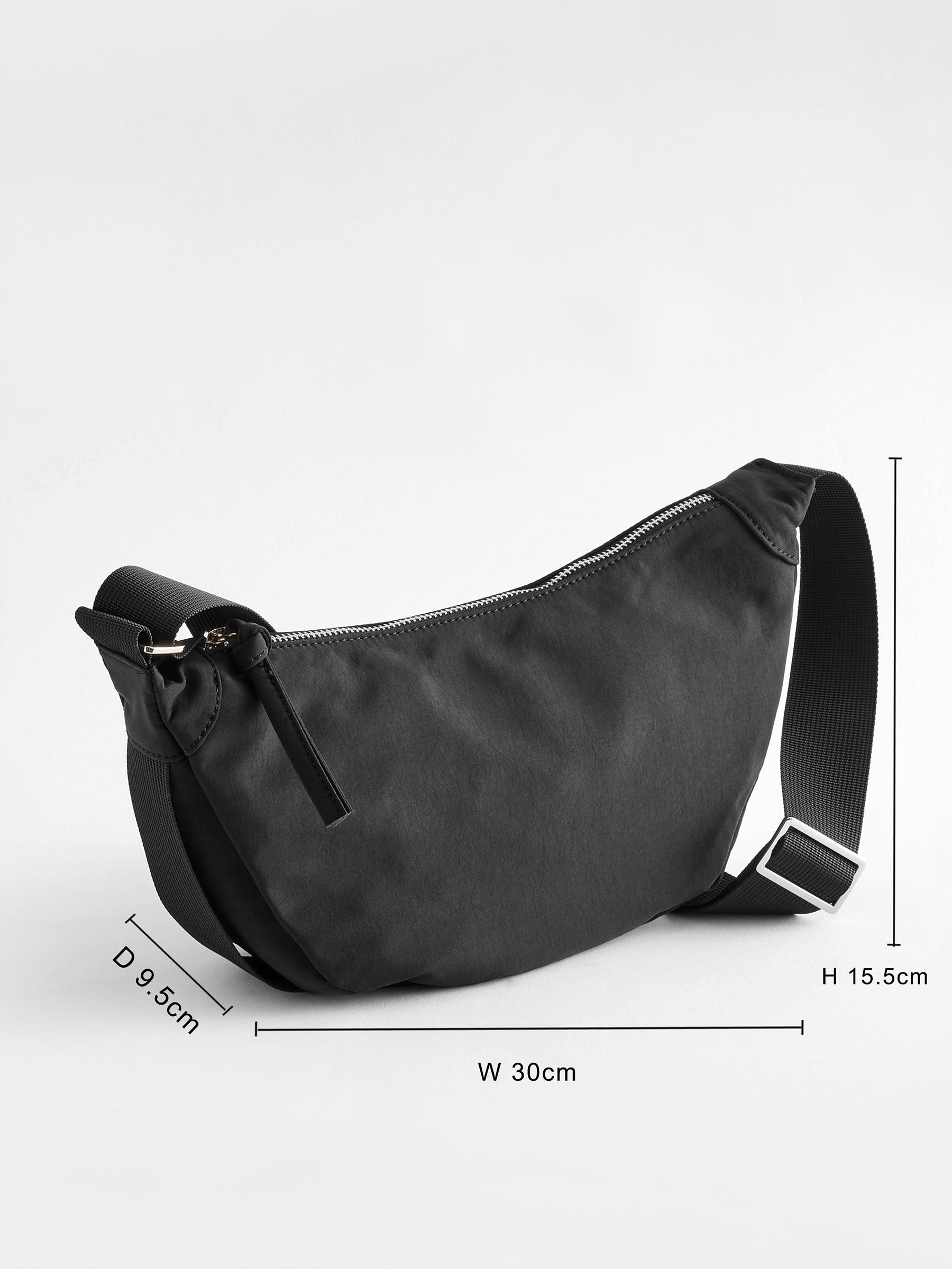 Black sling bag 30cm wide with recycled lining (British brand)