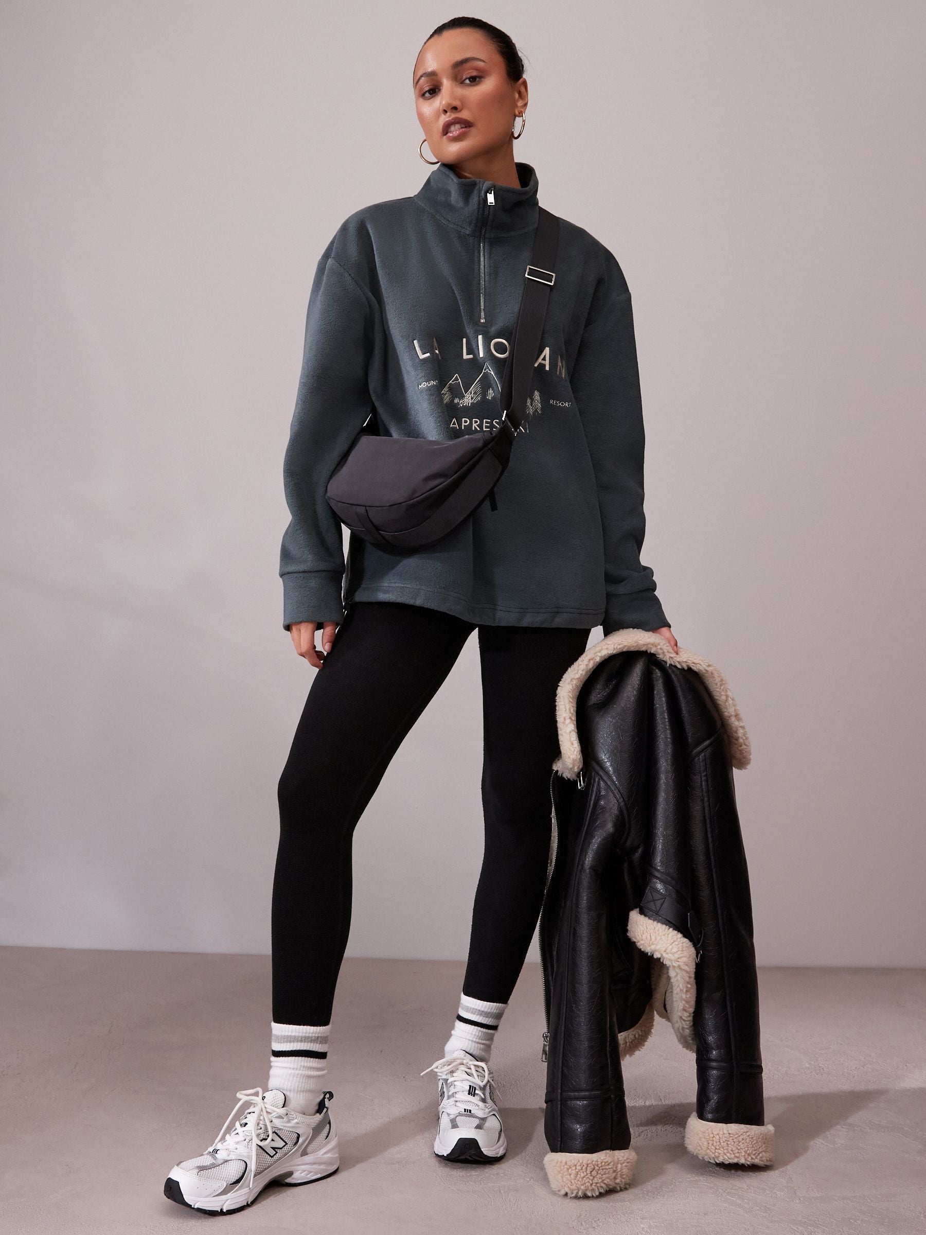 Black sling bag 30cm wide with recycled lining (British brand)