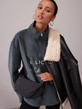 Black sling bag 30cm wide with recycled lining (British brand)