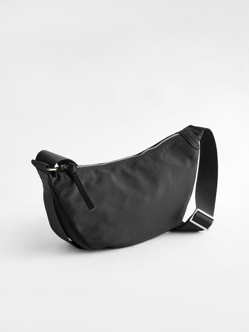 Black sling bag 30cm wide with recycled lining (British brand)