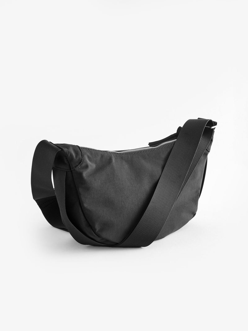 Black sling bag 30cm wide with recycled lining (British brand)