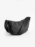Black sling bag 30cm wide with recycled lining (British brand)