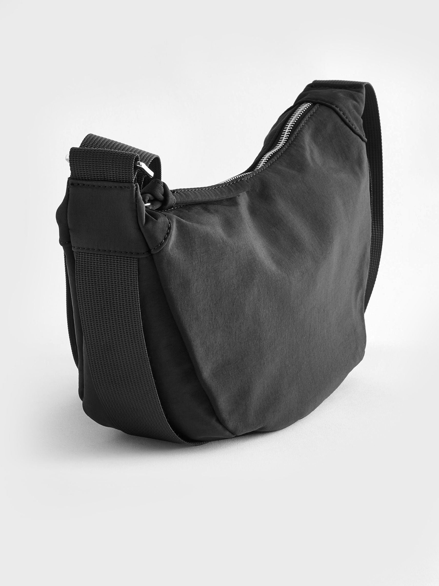 Black sling bag 30cm wide with recycled lining (British brand)