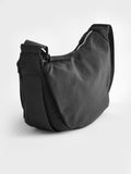 Black sling bag 30cm wide with recycled lining (British brand)