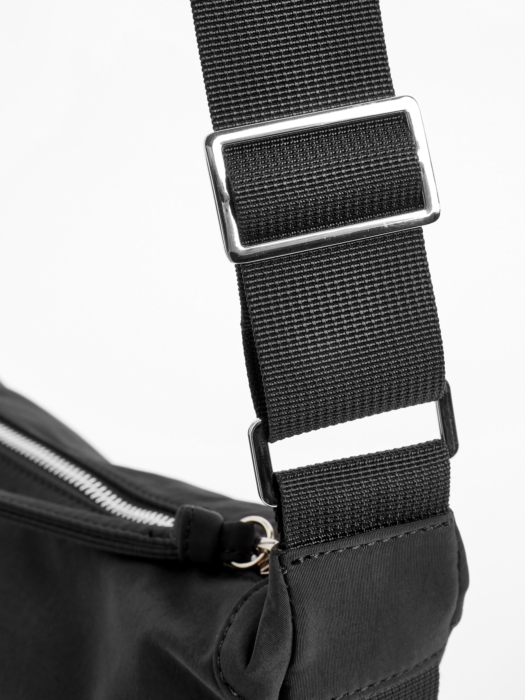Black sling bag 30cm wide with recycled lining (British brand)