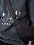 Black sling bag 30cm wide with recycled lining (British brand)