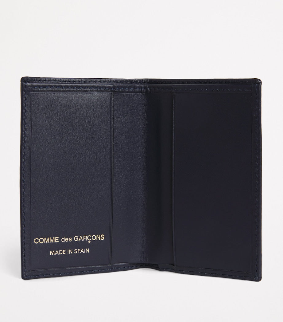 Comme des Garçons leather bifold card holder 10x7cm, imported from the UK