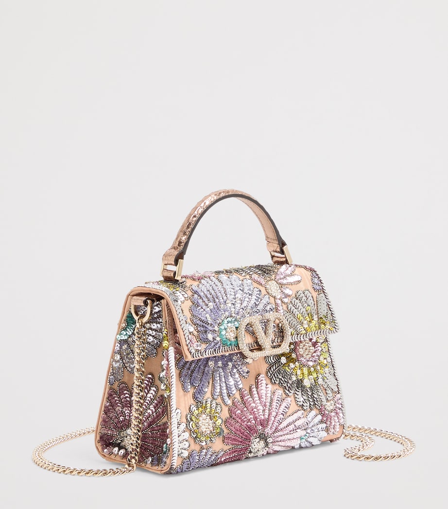 Valentino Garavani VSLING sequinned top-handle bag - British product