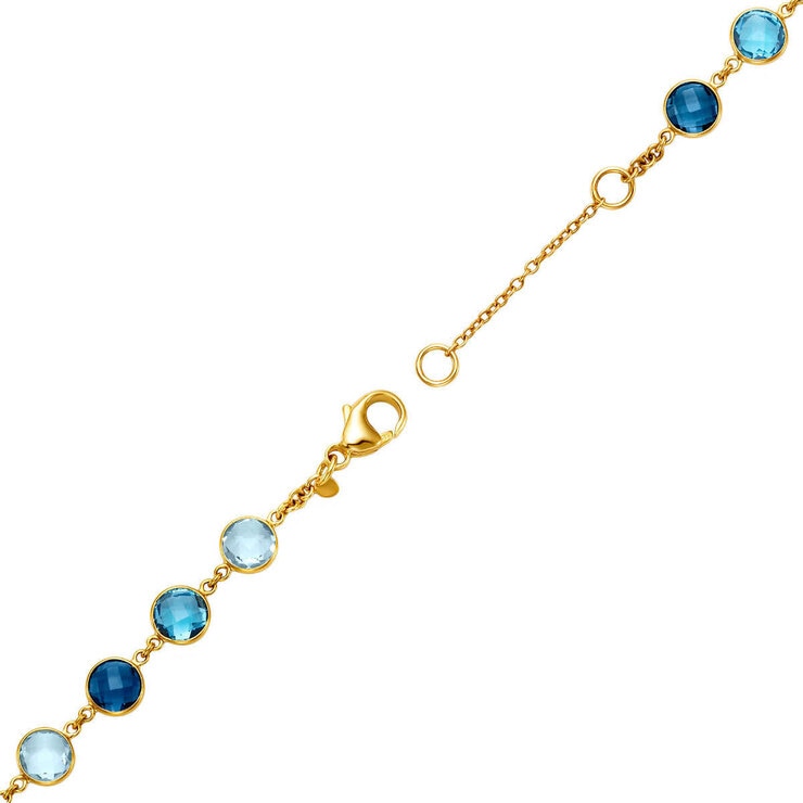 Blue topaz round cut bracelet in 14ct yellow gold (British brand)