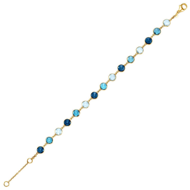 Blue topaz round cut bracelet in 14ct yellow gold (British brand)