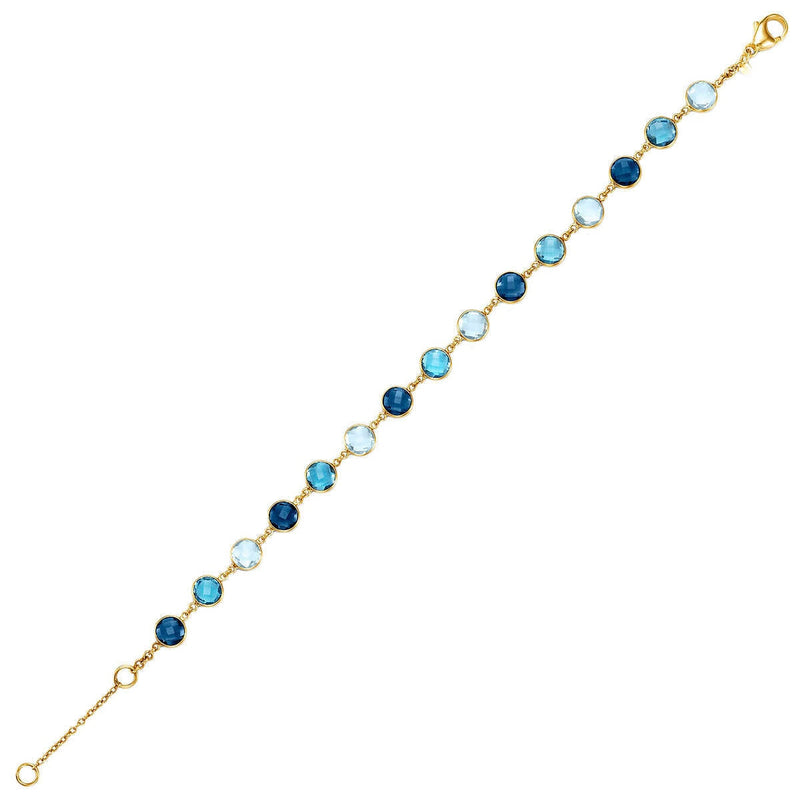 Blue topaz round cut bracelet in 14ct yellow gold (British brand)