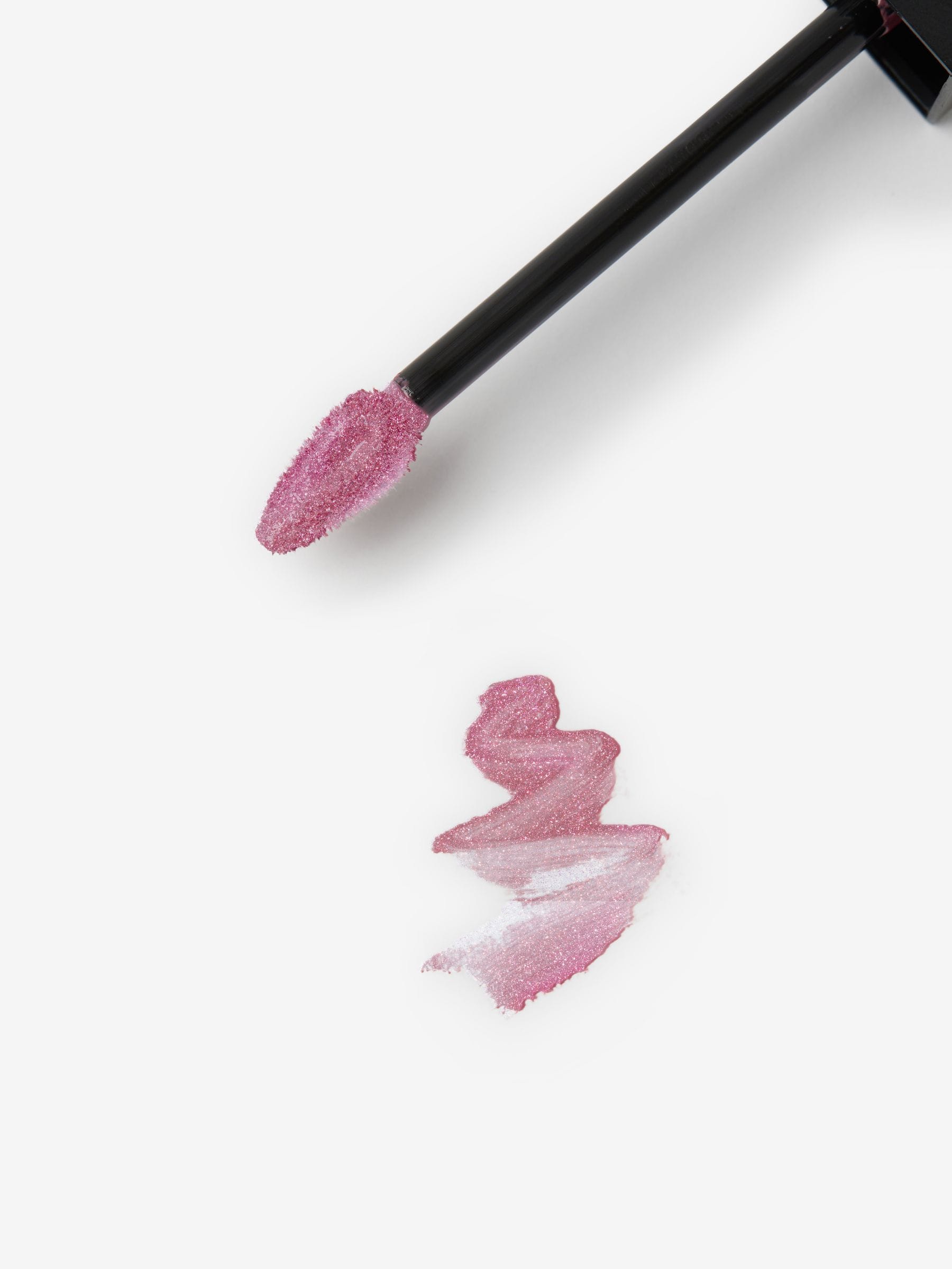Lightly tinted pink spritz shimmer lip gloss (British brand)