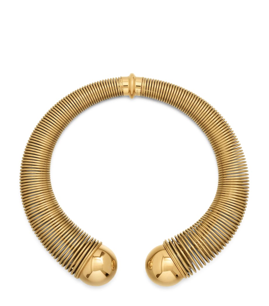 Alaïa spiral gold-tone choker with metal beads, imported from the UK