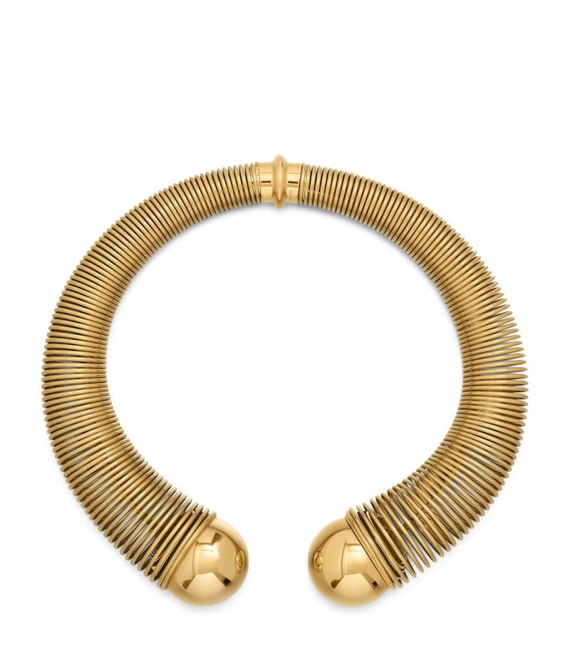 Alaïa spiral gold-tone choker with metal beads, imported from the UK
