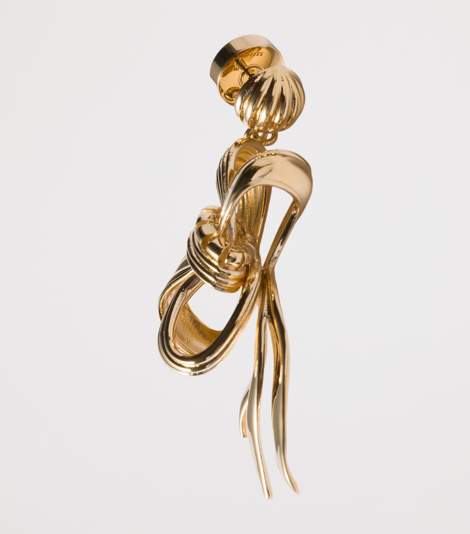Miu Miu gold-tone metal bow earrings, imported from the UK