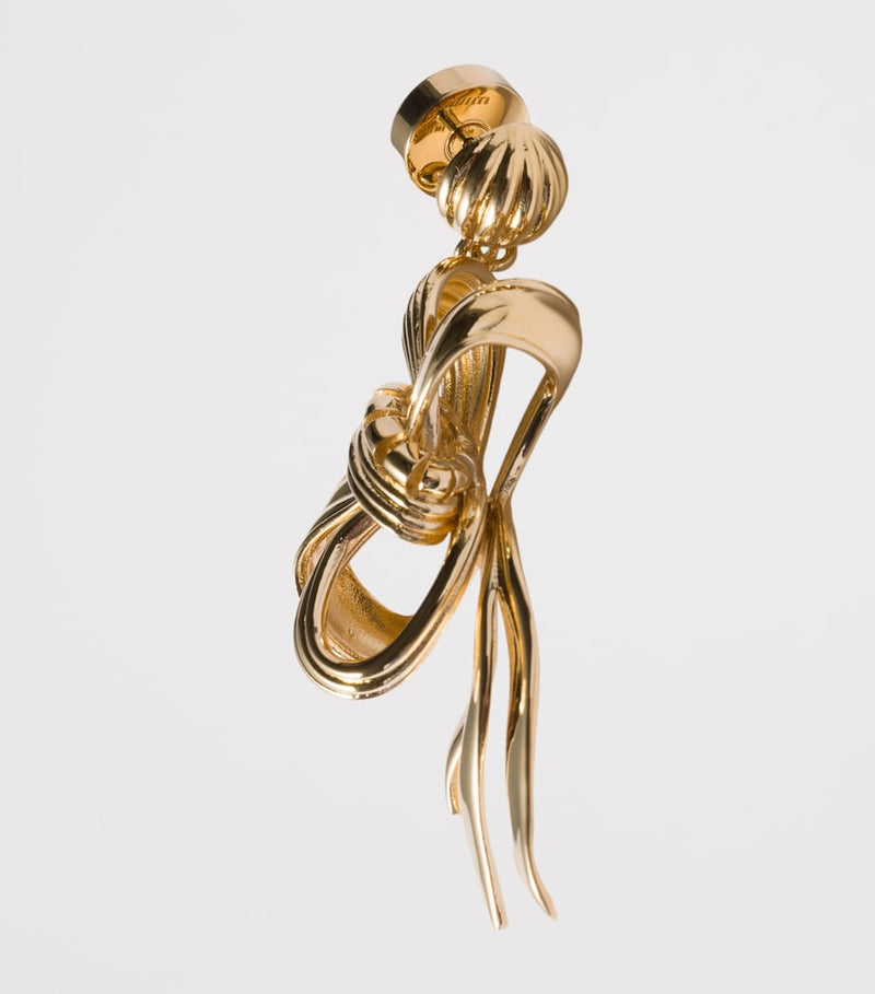 Miu Miu gold-tone metal bow earrings, imported from the UK