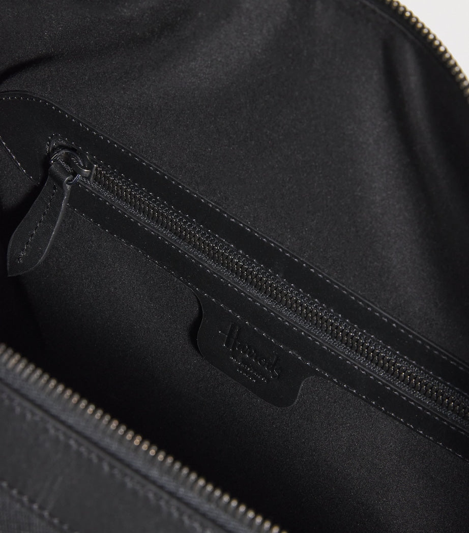 Harrods leather holdall with gunmetal hardware, imported from the UK