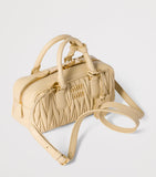 Miu Miu Arcadie matelassé leather top-handle bag, imported from the UK