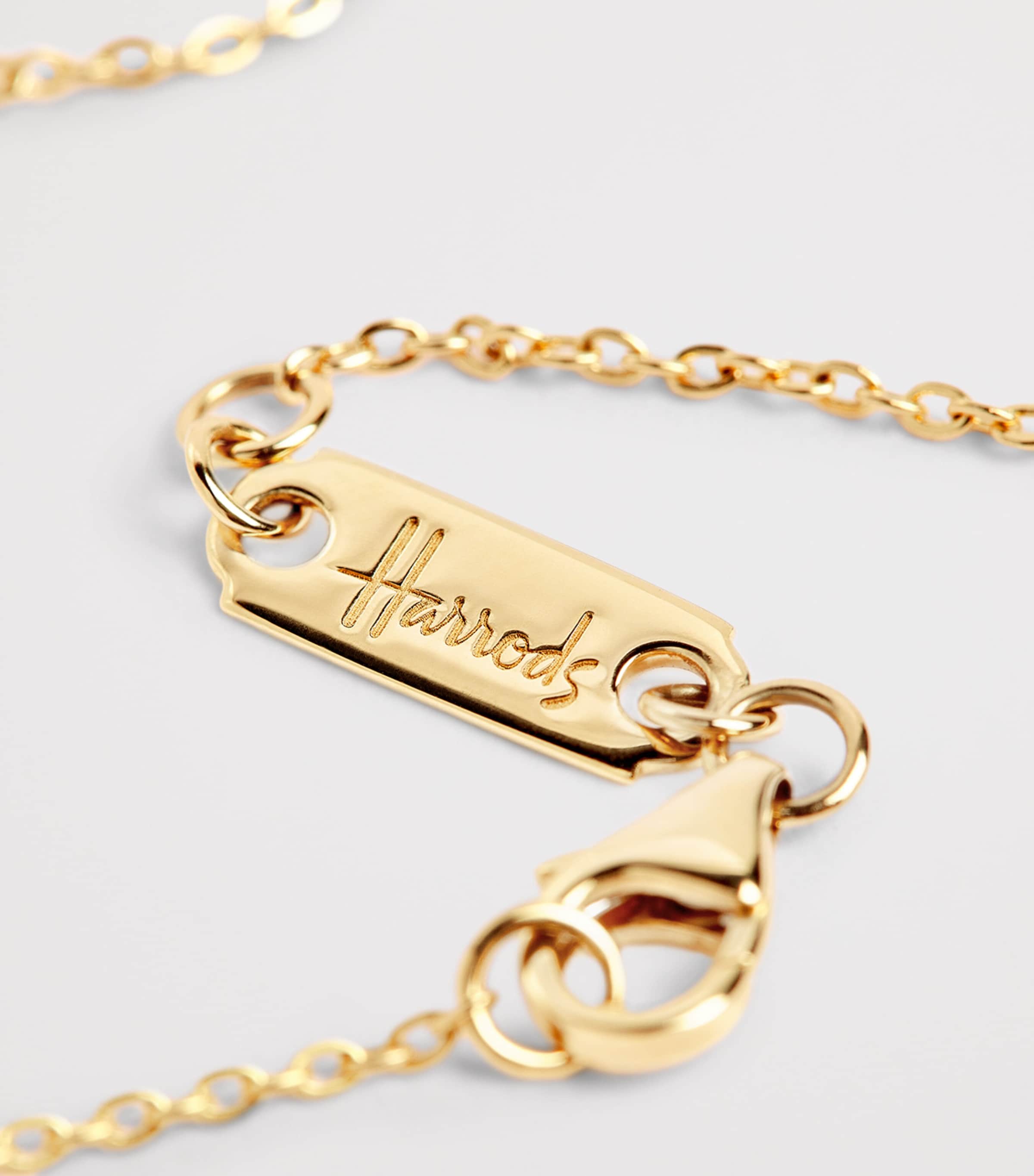 Harrods 18kt yellow gold pendant with 0.25ct diamond (British brand)