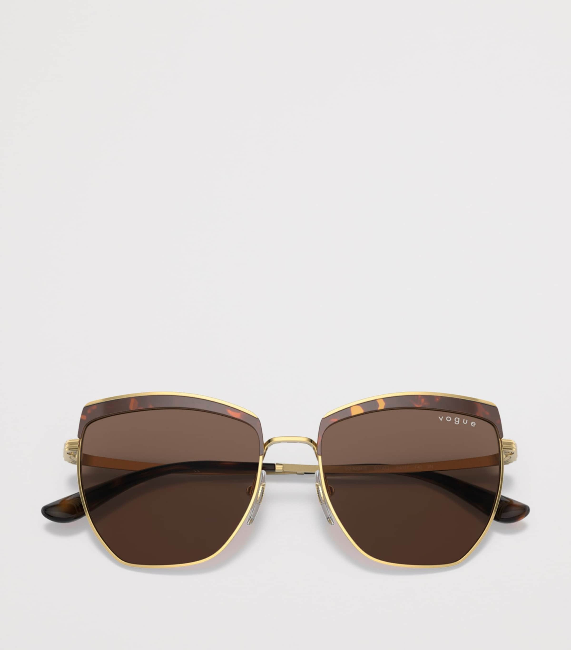 Vogue metal irregular sunglasses with oversized cat-eye design, UK version
