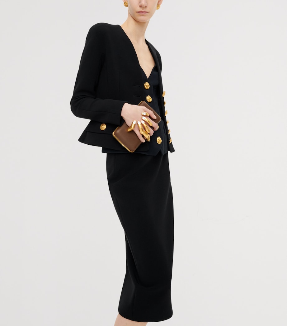 Schiaparelli Hand In Hand clutch bag with rhinestone fingernails, imported from the UK