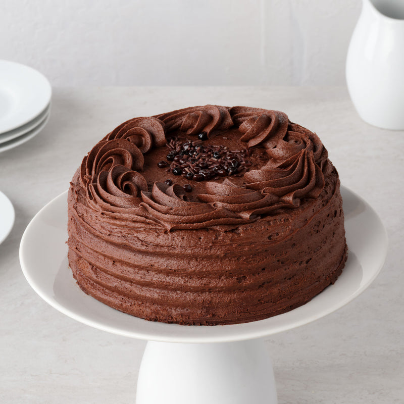 Vegan chocolatey cake slice with brownie fudge pieces - British product