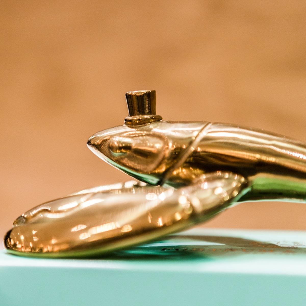 Fortnum's lobster bottle opener in metallic gold with engraved logo - British product