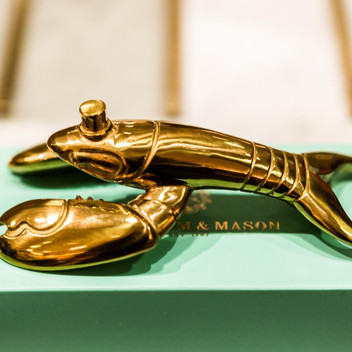 Fortnum's lobster bottle opener in metallic gold with engraved logo - British product