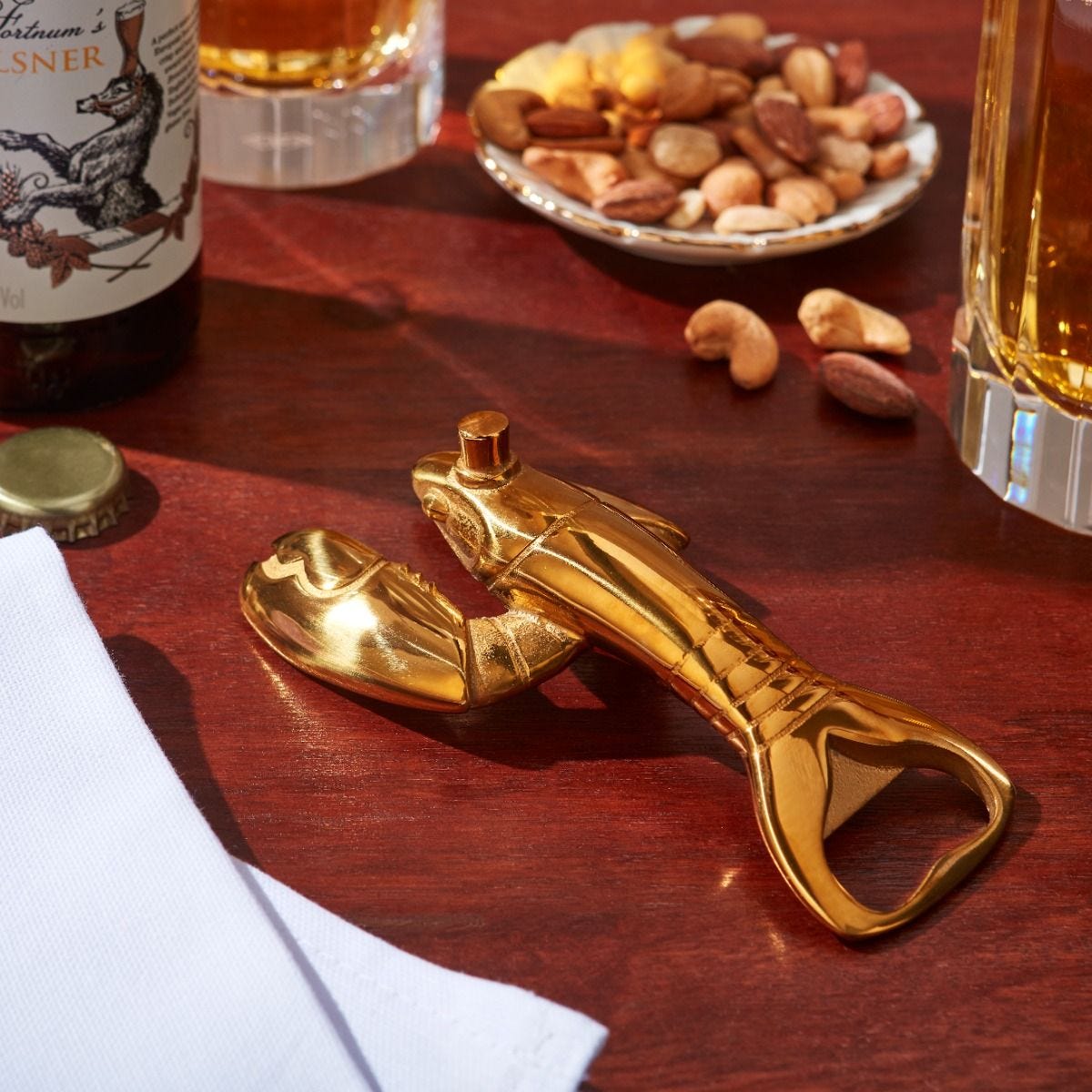 Fortnum's lobster bottle opener in metallic gold with engraved logo - British product
